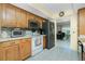 Efficient kitchen features wooden cabinetry and modern appliances at 2550 Ivanhoe St, Port Charlotte, FL 33952
