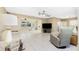 Spacious living room featuring tile flooring, neutral walls, ample natural light, and a comfortable seating arrangement at 2550 Ivanhoe St, Port Charlotte, FL 33952