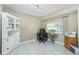 Cozy office space with tile floors, a window and built-in cabinet at 2550 Ivanhoe St, Port Charlotte, FL 33952