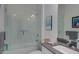 Bathroom featuring a glass enclosed shower/tub, a white vanity with a gray countertop, and chrome fixtures at 27500 Janzen Ct, Englewood, FL 34223