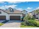 A charming single-story home with a tile roof, well-manicured lawn, and a two-car garage, perfect for a Gathering at 27500 Janzen Ct, Englewood, FL 34223