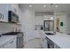 Close-up of the well-equipped kitchen showcasing sleek appliances, ample counter space, and modern fixtures at 27500 Janzen Ct, Englewood, FL 34223