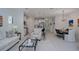 Open-concept living room seamlessly flows into the kitchen and dining area, enhancing the sense of space and connectivity at 27500 Janzen Ct, Englewood, FL 34223