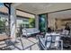 A beautifully screened patio, ideal for outdoor relaxation and enjoying serene views and seamless indoor-outdoor living at 27500 Janzen Ct, Englewood, FL 34223