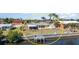 Aerial view of the property with a waterfront backyard, including a private dock and canal access at 3100 Magnolia Way, Punta Gorda, FL 33950