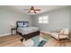 Cozy bedroom features a decorative rug, ceiling fan, and neutral walls at 3100 Magnolia Way, Punta Gorda, FL 33950