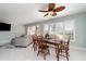 Inviting dining area featuring a decorative ceiling fan, and natural light from shuttered windows at 3100 Magnolia Way, Punta Gorda, FL 33950