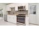 Well-equipped kitchen featuring granite countertops, stainless steel appliances, and ample cabinet space at 3100 Magnolia Way, Punta Gorda, FL 33950