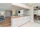 Bright kitchen features an island with granite countertops and ample storage space at 3100 Magnolia Way, Punta Gorda, FL 33950
