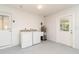 Utility room with a washer, dryer, water heater and sink at 3100 Magnolia Way, Punta Gorda, FL 33950