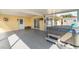 Covered and screened-in patio featuring a jacuzzi tub, outdoor fan, and sliding glass doors at 3100 Magnolia Way, Punta Gorda, FL 33950