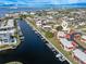 Aerial view of a waterfront residential area, showing the layout of homes along the canal and boat docks at 311 Garvin St # 401C, Punta Gorda, FL 33950