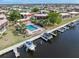 Aerial shot highlighting a community pool and private boat docks, enhancing the waterfront living experience at 311 Garvin St # 401C, Punta Gorda, FL 33950