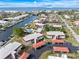 Aerial view of waterfront community, showcasing the canal system and boat docks amidst the homes at 311 Garvin St # 401C, Punta Gorda, FL 33950