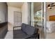 Private balcony featuring comfortable seating and sliding glass doors, offering a peaceful outdoor space with indoor-outdoor flow at 311 Garvin St # 401C, Punta Gorda, FL 33950