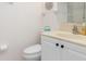 Bathroom with a toilet, sink, and vanity with cabinet space at 311 Garvin St # 401C, Punta Gorda, FL 33950