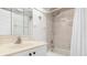 Well-lit bathroom featuring a shower-tub combo with tiled walls and a single sink vanity at 311 Garvin St # 401C, Punta Gorda, FL 33950