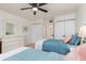 Comfortable bedroom with twin beds, closet, and a dresser, ideal for guests or Gathering members at 311 Garvin St # 401C, Punta Gorda, FL 33950