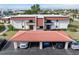 Exterior shot of the residential complex featuring carports with red tile roofs and well-maintained landscaping at 311 Garvin St # 401C, Punta Gorda, FL 33950