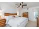 Inviting bedroom with a ceiling fan, comfortable bed, and wood furnishings, creating a cozy and relaxing atmosphere at 311 Garvin St # 401C, Punta Gorda, FL 33950