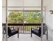 Screened in patio with seating and wooded views at 311 Garvin St # 401C, Punta Gorda, FL 33950
