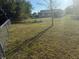 Extensive, grassy backyard, perfect for outdoor activities, and enjoying the natural surroundings at 3209 Sunrise Trl, Port Charlotte, FL 33952