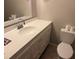 Bathroom with a toilet, sink with vanity, and a mirror at 3209 Sunrise Trl, Port Charlotte, FL 33952