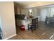 Open kitchen with stainless steel appliances, breakfast bar, and dining area access at 3209 Sunrise Trl, Port Charlotte, FL 33952