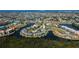 Waterfront condo community with lush landscaping, water access, pool, and tennis court at 3256 White Ibis Ct # 13B, Punta Gorda, FL 33950