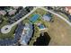 Aerial view of condo featuring boat dock, pool, tennis court and convenient parking for residents at 3256 White Ibis Ct # 13B, Punta Gorda, FL 33950