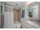 Bathroom with shower-tub combo, complemented by a vanity and modern fixtures at 3256 White Ibis Ct # 13B, Punta Gorda, FL 33950