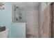 Bright bathroom with stylish tiled walk-in shower and updated fixtures at 3256 White Ibis Ct # 13B, Punta Gorda, FL 33950