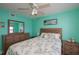 Comfortable bedroom with light turquoise walls and coordinated coastal-themed decor at 3256 White Ibis Ct # 13B, Punta Gorda, FL 33950