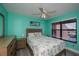 Coastal bedroom design with tropical bedding, light walls, and bright sunlight at 3256 White Ibis Ct # 13B, Punta Gorda, FL 33950