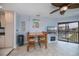 Bright dining room with views of the water features a tv and a fireplace at 3256 White Ibis Ct # 13B, Punta Gorda, FL 33950