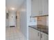 View of the entryway features tile floors, gray granite countertops, and an adjacent kitchen at 3256 White Ibis Ct # 13B, Punta Gorda, FL 33950