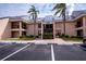 Exterior shot of the building featuring multiple balconies and ample parking at 3256 White Ibis Ct # 13B, Punta Gorda, FL 33950