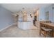 Bright kitchen with an island, granite countertops, and modern appliances is perfect for cooking and entertaining at 3256 White Ibis Ct # 13B, Punta Gorda, FL 33950