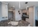 Modern kitchen features stainless steel appliances, granite countertops, and stylish pendant lighting at 3256 White Ibis Ct # 13B, Punta Gorda, FL 33950