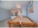 A kitchen and dining area features beach-themed wall art, and a modern hanging light fixture at 3256 White Ibis Ct # 13B, Punta Gorda, FL 33950