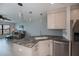 Open kitchen with granite counters, stainless appliances, and view into living area for easy entertaining at 3256 White Ibis Ct # 13B, Punta Gorda, FL 33950