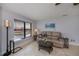 Cozy living room featuring tile flooring, water views, and a comfortable seating area at 3256 White Ibis Ct # 13B, Punta Gorda, FL 33950
