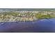 Expansive aerial view showcasing the waterfront homes with docks along the bay, with clear access to open water at 4381 Northshore Dr, Punta Gorda, FL 33980