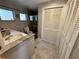 Bathroom with white vanity, toilet, and shower at 4381 Northshore Dr, Punta Gorda, FL 33980