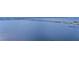 Panoramic view of the bay waters, featuring a distant bridge and skyline, offering scenic vistas and a serene setting at 4381 Northshore Dr, Punta Gorda, FL 33980