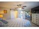 Spacious bedroom with ceiling fan and sliding glass doors at 4381 Northshore Dr, Punta Gorda, FL 33980