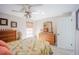 Bright bedroom with tropical decor, wicker furniture, and a large mirror above the dresser at 4381 Northshore Dr, Punta Gorda, FL 33980