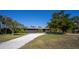 Charming single-story home with a spacious front yard and a long driveway at 4381 Northshore Dr, Punta Gorda, FL 33980