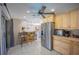 Modern kitchen with stainless steel appliances and stylish bar seating, ideal for entertaining guests at 4381 Northshore Dr, Punta Gorda, FL 33980