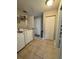 The laundry room has tiled floors, storage space, and modern appliances at 4381 Northshore Dr, Punta Gorda, FL 33980